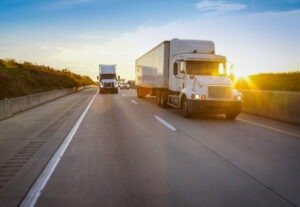 An 18-wheeler on the highway. You can build a legal claim with a Stuart 18-wheeler accident lawyer.