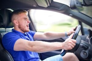 A reckless driver behind the wheel. A Miami reckless driving accident lawyer can help you after a collision.