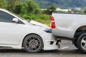 A car and truck after a collision. You can contact a rear-end accident lawyer in this situation.