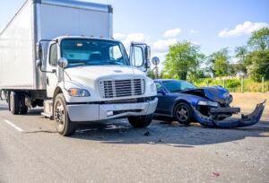 a-collision-between-a-truck-and-a-car-the-injured-victim-seeks-a-settlement-after-the-truck-accident-to-cover-the-cost-of-property-damage